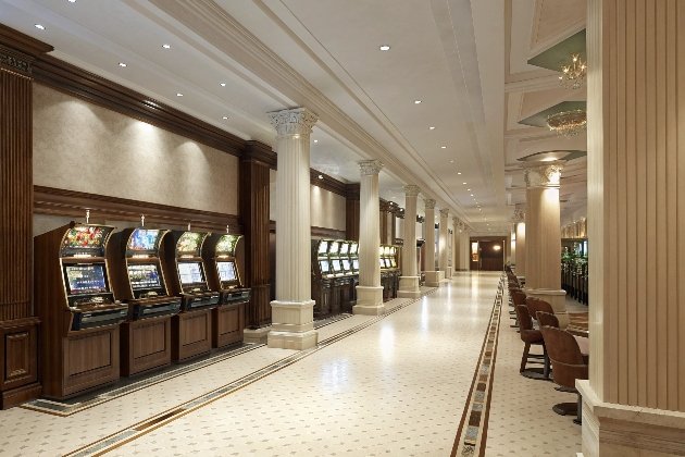 Slot Machines Row Row of modern slot machines in spacious gaming hall