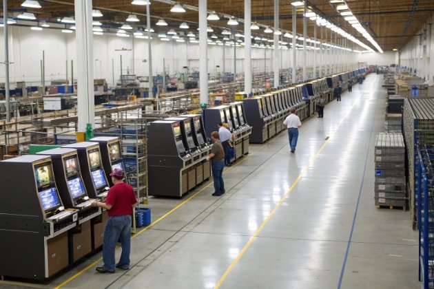 Factory floor with workers assembling gaming machines