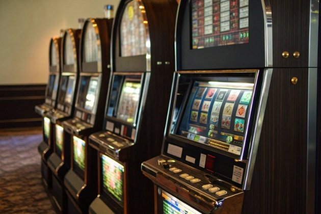 Row of premium slot machines in elegant gaming venue